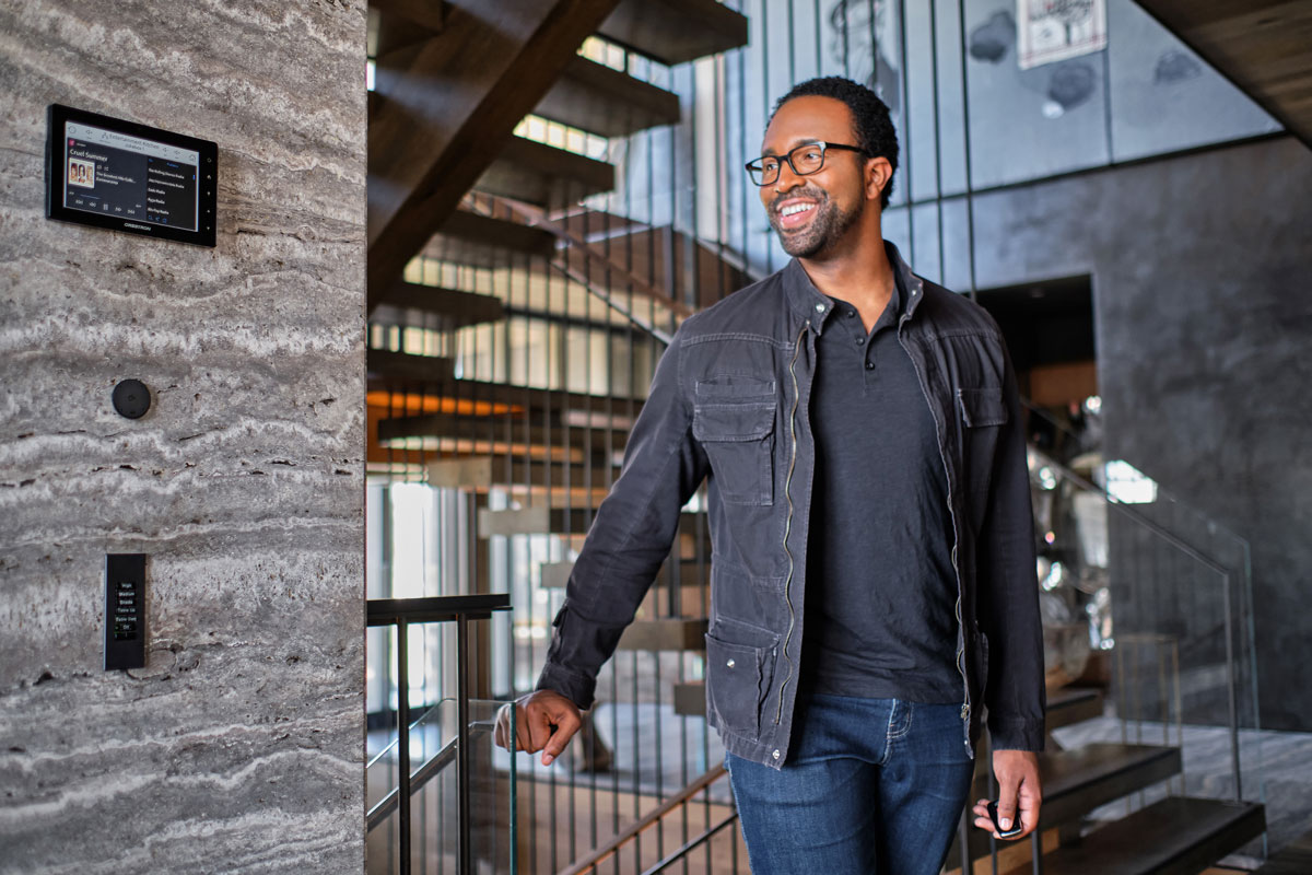 person walking next to wall mounted josh ai equipment
